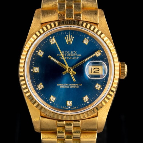 Rolex Datejust 16238 in 18k yellow gold with factory blue diamond marker dial and fluted bezel