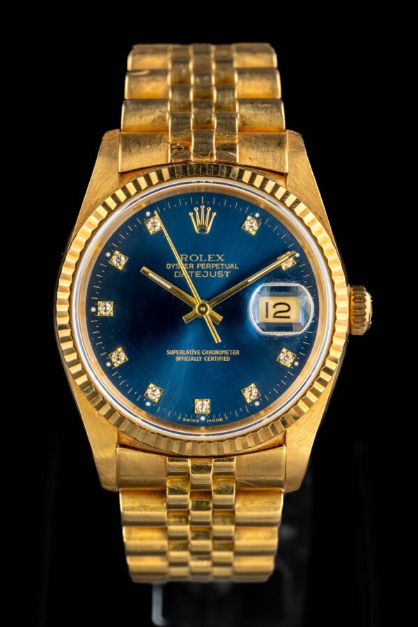 Rolex Datejust 16238 in 18k yellow gold with factory blue diamond marker dial and fluted bezel
