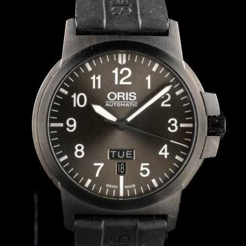 t Oris BC3 Advanced Day Date in dark PVD steel with grey sunburst dial and day-date window on black rubber strap