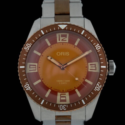 2023 Oris Divers Seventy-Five Calibre 400 Collective Horology with orange dial and brown bezel on two-tone bracelet